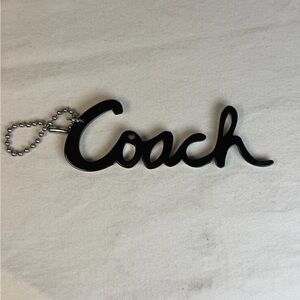 Coach Logo Bag Charm Acrylic Black and Mirror 4 1/4” long.  Silver hardware
